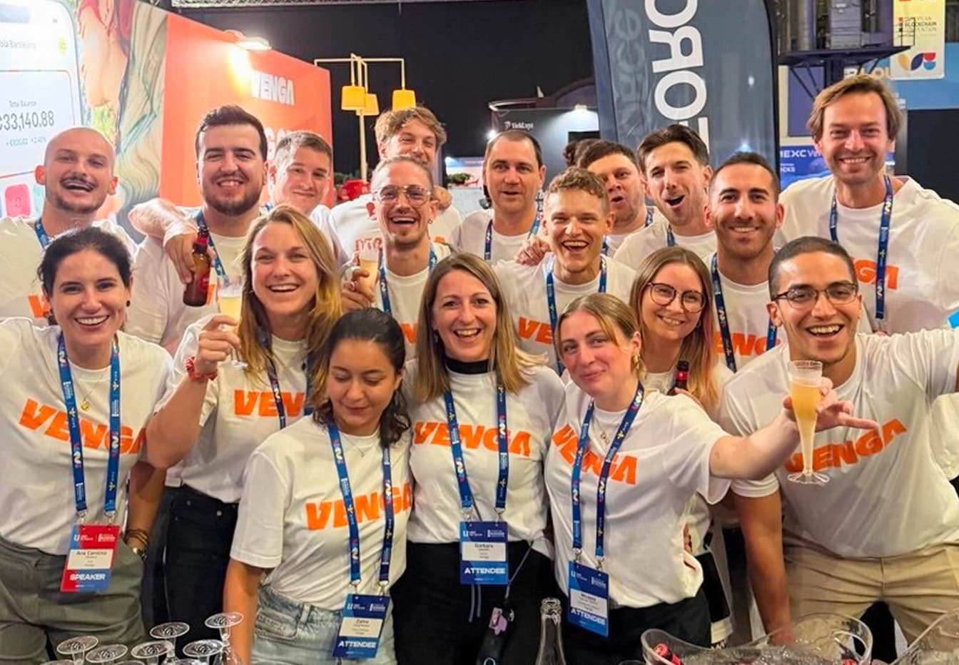 Venga team celebration with banner